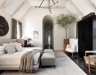 bedroom ideas with white walls and indoor tree and arched door