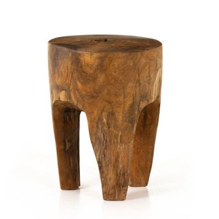 A wooden plinth end table