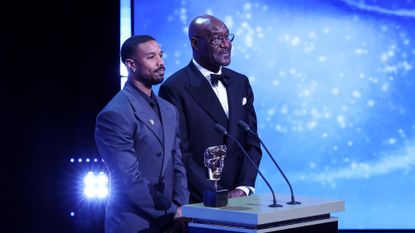Michael B. Jordan and Delroy Lindo present the Special Visual Effects Award on stage during the EE BAFTA Film Awards 2026