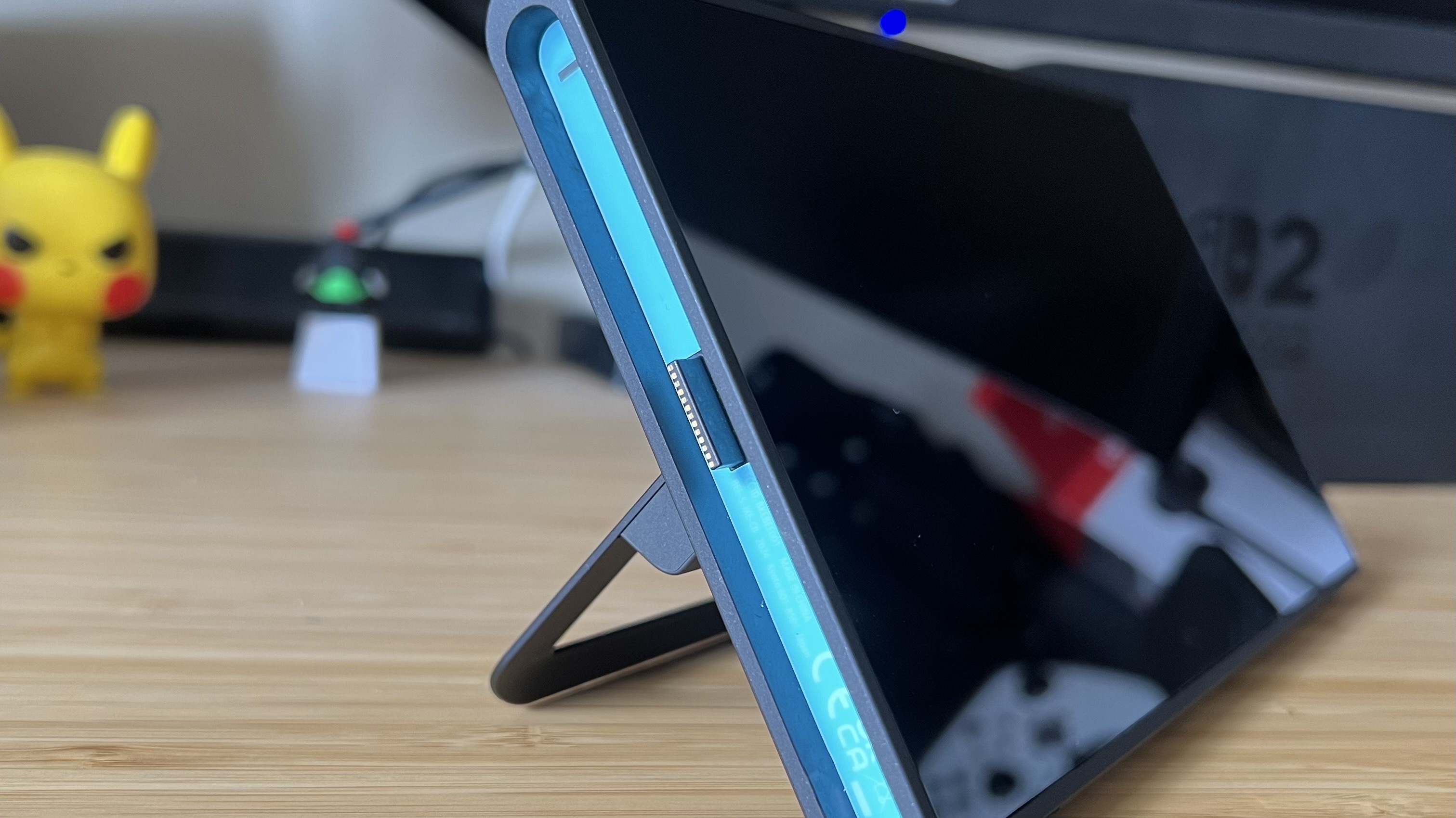 Close up on magnetic pin connectors on left side of Nintendo Switch 2