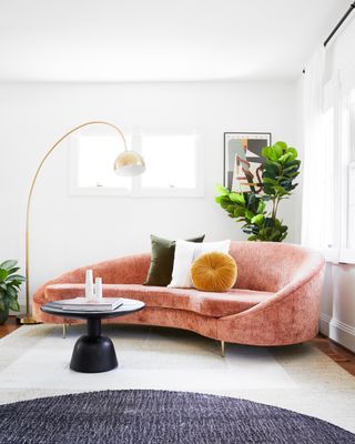 Small living room with pink chaise sofa