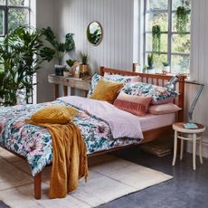 bedroom with grey flooring and plants