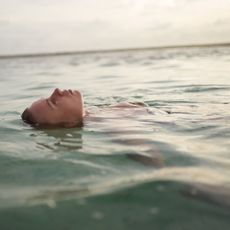 Woman floating in the sea