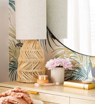 dressing room with tropical wallpaper and mirror
