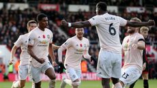 Teammates Marcus Rashford and Paul Pogba celebrate a goal for Manchester United 