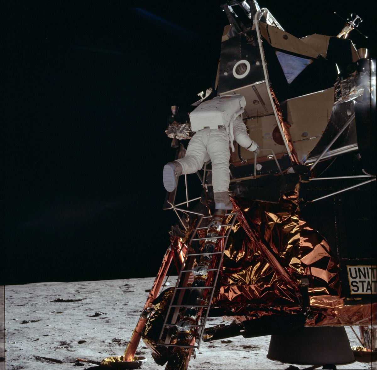 Buzz Aldrin, the second person to walk on the moon, descends the ladder to the lunar surface.