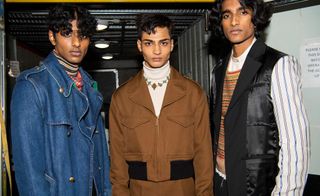 3 male models pose for the camera in jackets