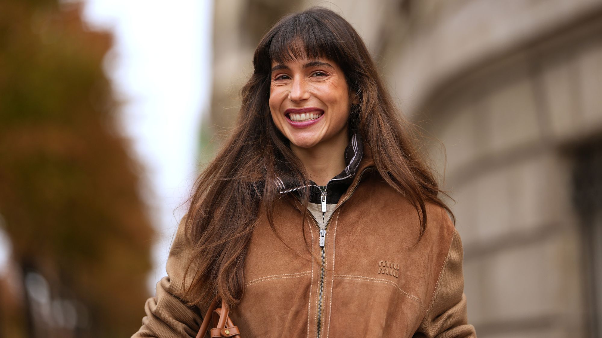 brunette woman with a bouncy blow dry