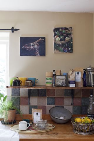 kitchen shelves with coloured tiles and kitchen supplies