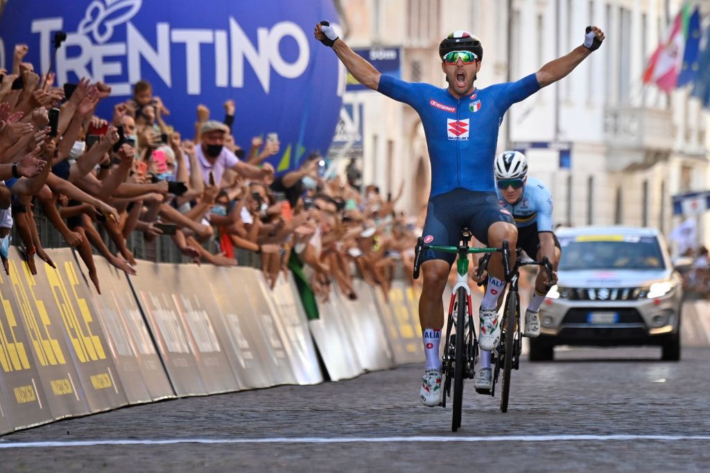 Italian Sonny Colbrelli crosses the finish line and win the UEC European men Elite road cycling championships in Trento on September 12 2021 Colbrelli won the race ahead of Belgian Remco Evenenpoel placed second and France Benoit Cosnefroy placed third Photo by Alberto PIZZOLI AFP Photo by ALBERTO PIZZOLIAFP via Getty Images