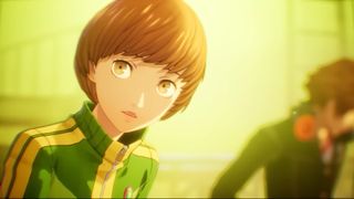 Persona 4 Revival screenshot shows Chie looking to the camera, Yosuke in the background.