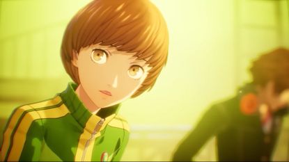 Persona 4 Revival screenshot shows Chie looking to the camera, Yosuke in the background.
