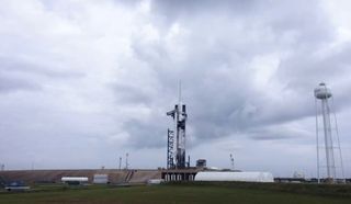 A SpaceX Falcon 9 rocket carrying 60 Starlink internet satellites stands atop Pad 39A of NASA's Kennedy Space Center in Cape Canaveral, Florida during a Sept. 28, 2020 launch attempt. 