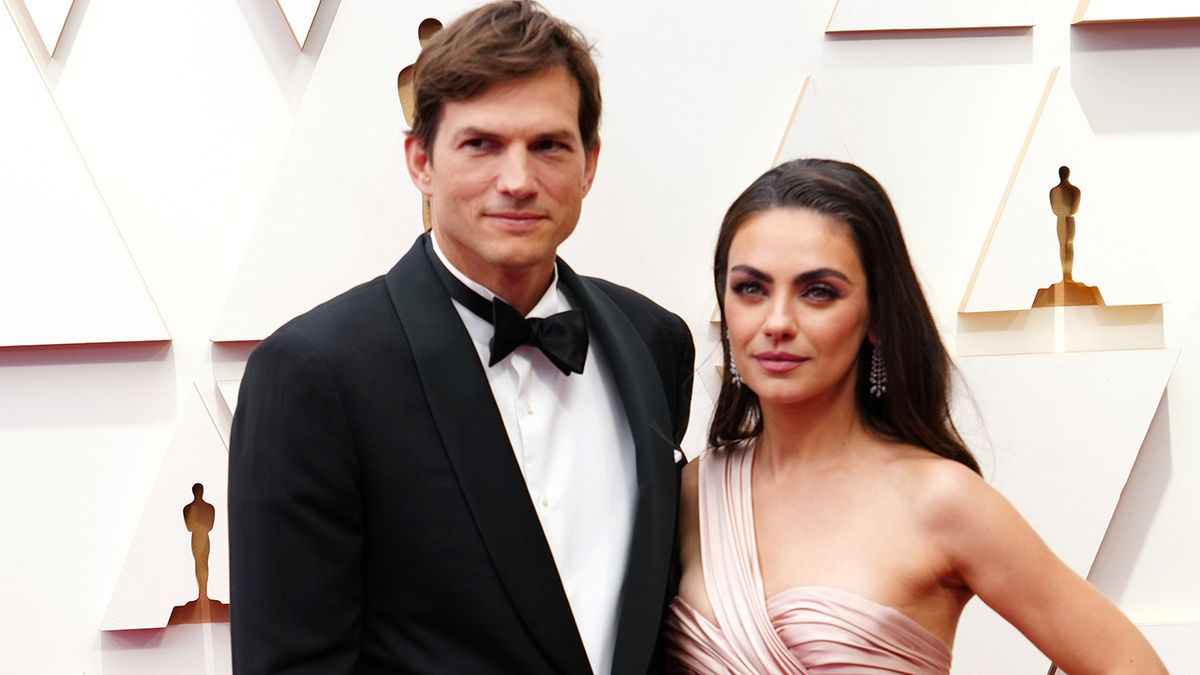 Mila Kunis and Ashton Kutcher on red carpet at the Oscars 2022.