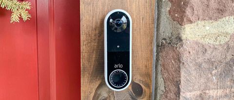 Arlo Essential Wireless Video Doorbell on door frame