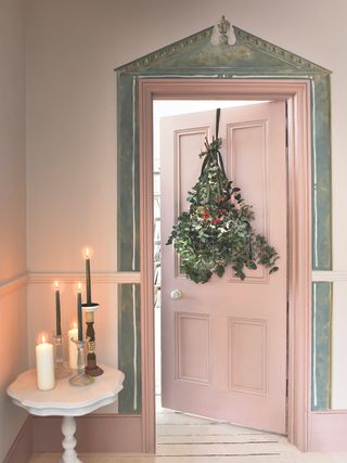 Dried Christmas bouquet on pink door by Annie Sloan