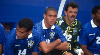 Brazil striker Ronaldo (second left) looks on from the bench at the 1994 World Cup.