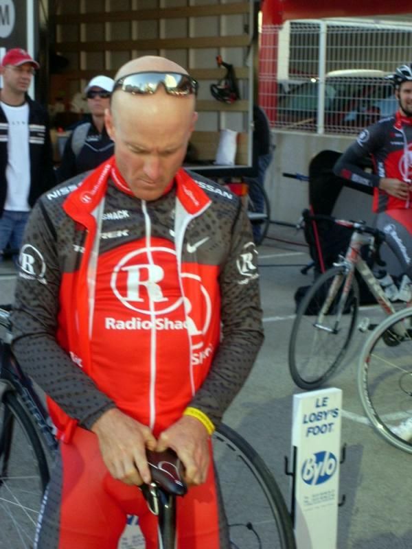 Levi Leipheimer fiddles with his saddle positioning before the ride.