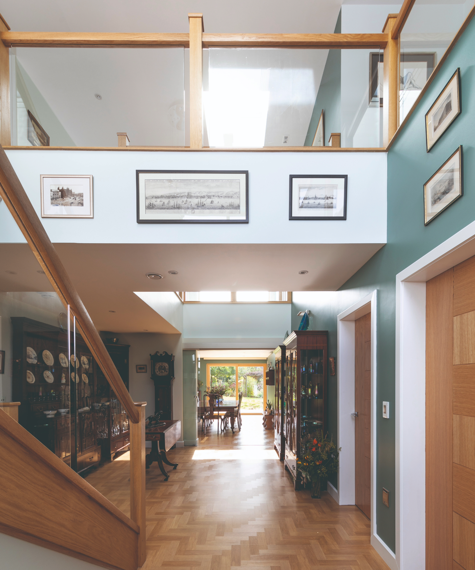 A hallway with a wooden staircase and bridge
