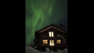 Auroras dazzle above a cabin in Trapper Creek, Alaska on April 11, 2022.