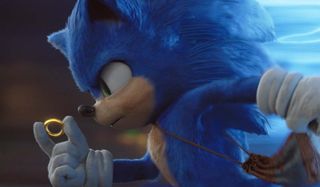 Sonic The Hedgehog holding a ring, while speeding