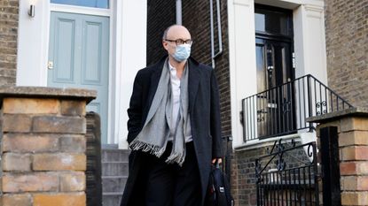 Dominic Cummings leaves his residence in London wearing a face mask.