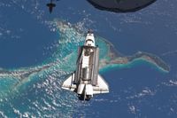 The space shuttle Atlantis is seen over the Bahamas prior to docking with the International Space Station on July 10, 2011, on the last mission of NASA’s space shuttle program. Aboard the shuttle were mice whose livers later showed signs of disease, after spending just 13.5 days in space.