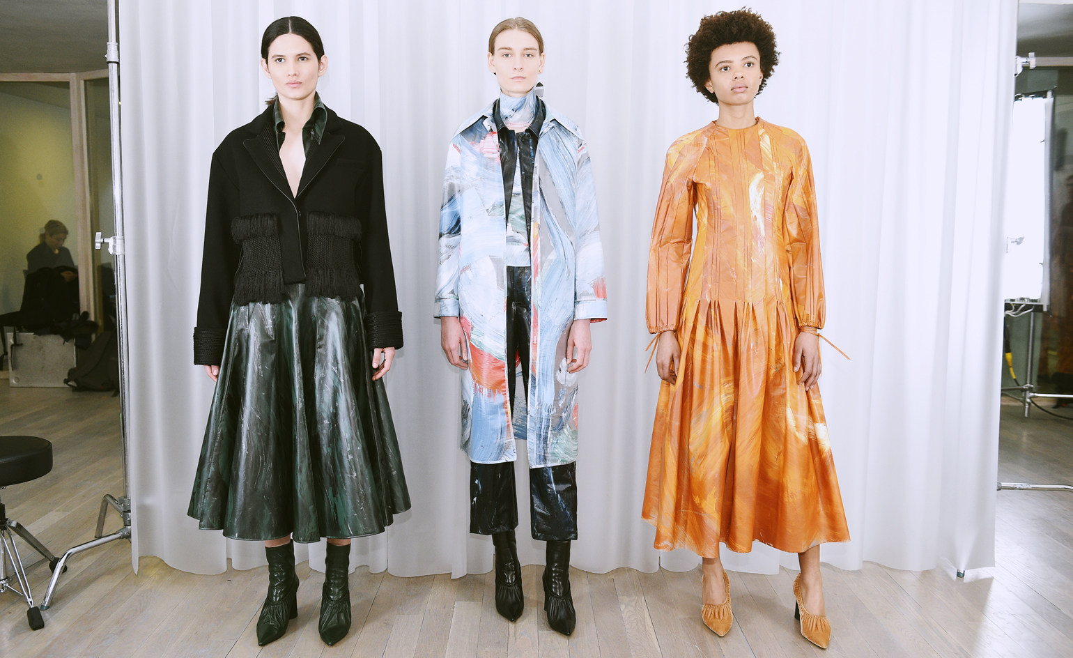 Models wear ruffled skirts, long line jackets and exotic dresses
