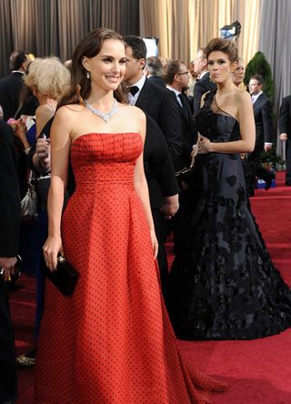 Natalie Portman as she poses on the red carpet at the 84th Academy Awards in 2012.