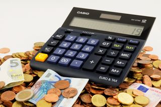 Calculator on pile of money