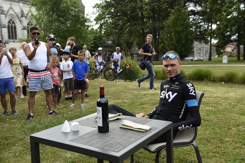 Chris Froome tries to relax outside the team bus on the rest day.