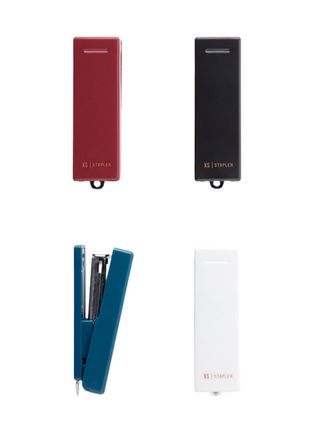 A series of red white black and blue mini staplers with minimalist design.