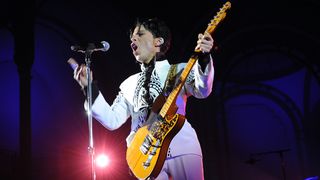 US singer Prince performs on October 11, 2009 at the Grand Palais in Paris. Prince has decided to give two extra concerts at the Grand Palais titled "All Day/All Night" after he discovered the exhibition hall during Karl Lagerfeld's Chanel fashion show. AFP PHOTO BERTRAND GUAY (Photo credit should read BERTRAND GUAY/AFP via Getty Images)