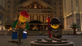 Best Lego games: a lego bankrobber and a Lego construction worker are opening a manhole cover
