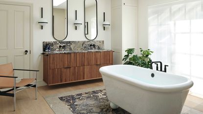 a modern bathroom with a centered tub