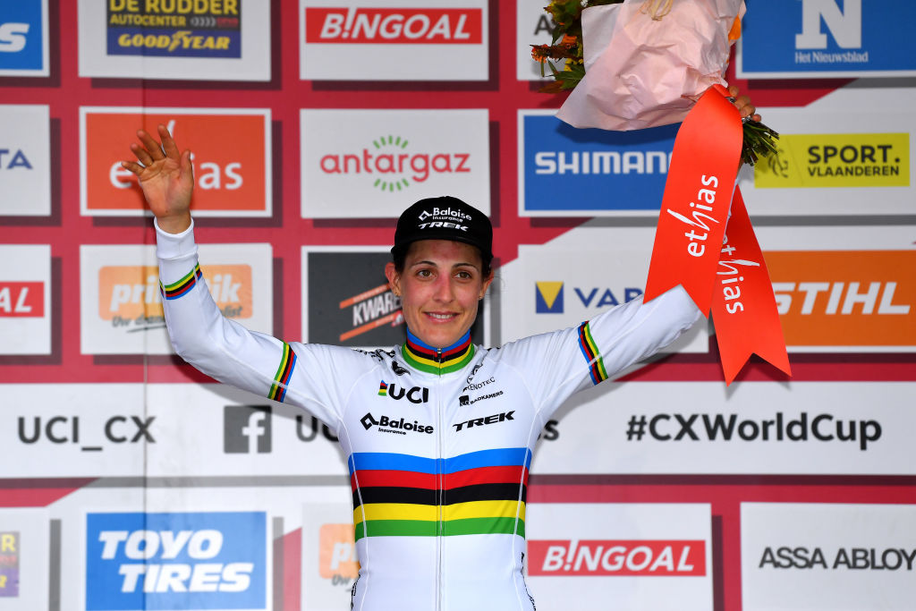 OVERIJSE BELGIUM OCTOBER 31 Lucinda Brand of The Netherlands and Team Baloise Trek Lions on third place poses on the podium ceremony after the 62nd Druivencross Overijse UCI CycloCross Worldcup 2021 Womens Elite DruivencrossOverijse CXWorldCup UCIcyclocrossWC on October 31 2021 in Overijse Belgium Photo by Luc ClaessenGetty Images