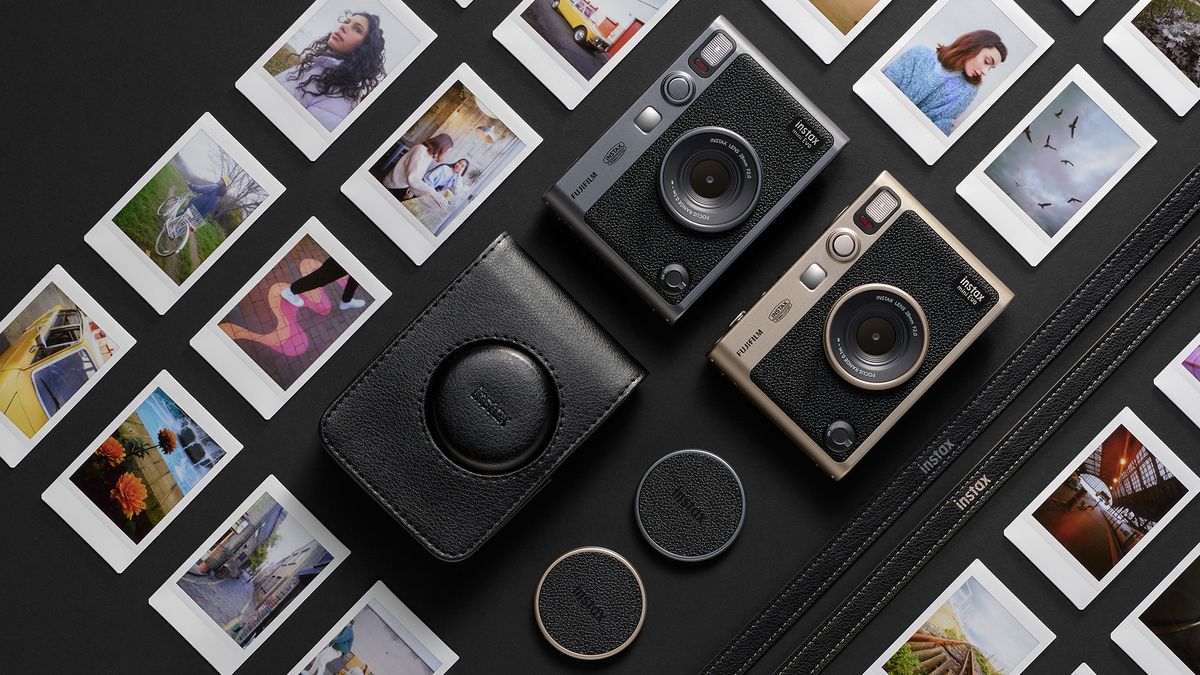 Top-down view of the Instax Mini Evo Anniversary Bundle, with Dark Silver and Titanium Gold cameras amid a selection of Instax Mini photographs