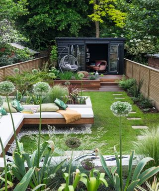 Narrow garden divided into different zones