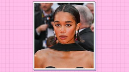 Laura Harrier wears a black dress and scarf as she attends the "Monster" red carpet during the 76th annual Cannes film festival at Palais des Festivals on May 17, 2023 in Cannes, France. / in a pink template