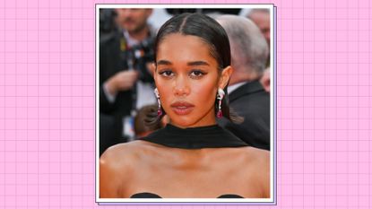 Laura Harrier wears a black dress and scarf as she attends the &quot;Monster&quot; red carpet during the 76th annual Cannes film festival at Palais des Festivals on May 17, 2023 in Cannes, France. / in a pink template