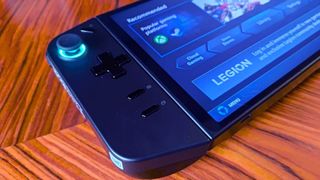 Close up of Lenovo Legion Go left controller on woodgrain table.
