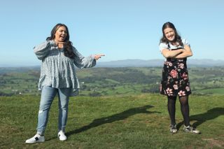 Scarlett Moffatt and Rosie Jones pose atop a hill in the Lake District