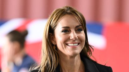 Kate Middleton's all black ensemble at latest engagement paired with a side-fringe. Seen here is the Princess of Wales during her visit to Royal Naval Air Station in September 2023