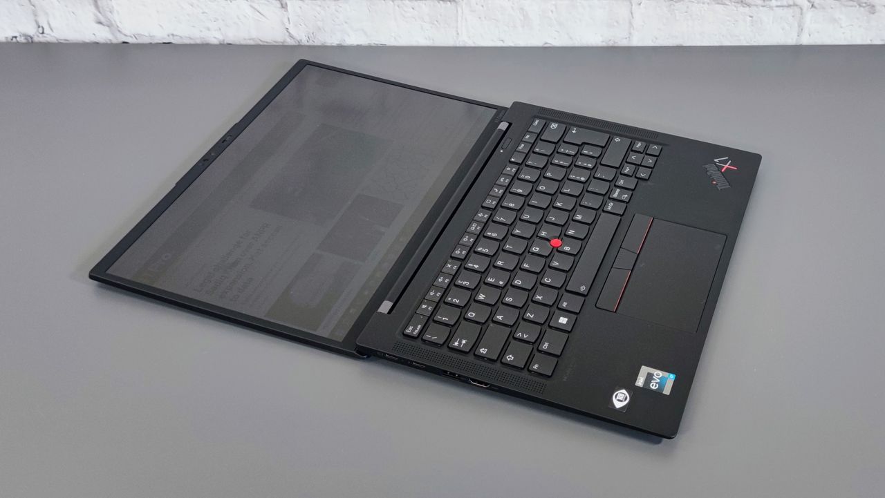 A photograph of the Lenovo ThinkPad X1 Carbon Gen 10 laid flat on a table