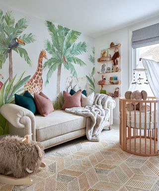 Baby boy nursery ideas with safari-inspired wall mural, wooden crib and taupe sofa.