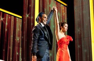 "Hunger Games" host Caesar Flickerman (Stanley Tucci) and heroine Katniss Everdeen (Jennifer Lawrence).