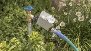 Orbit B-Hyve Hose Faucet Timer installed outdoors