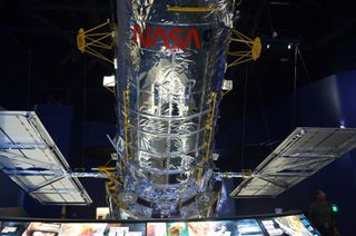 The space shuttle ehibit at Kennedy Space Center features a life-size model of the Hubble Telescope, which shuttle Atlantis rendezvoused with in orbit for repairs.