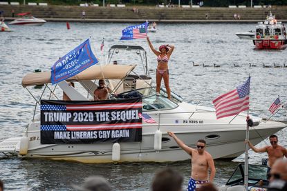 Trump supporters parade on boats.
