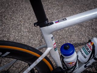 Roglič has a name sticker on the top tube just in front of the seat post